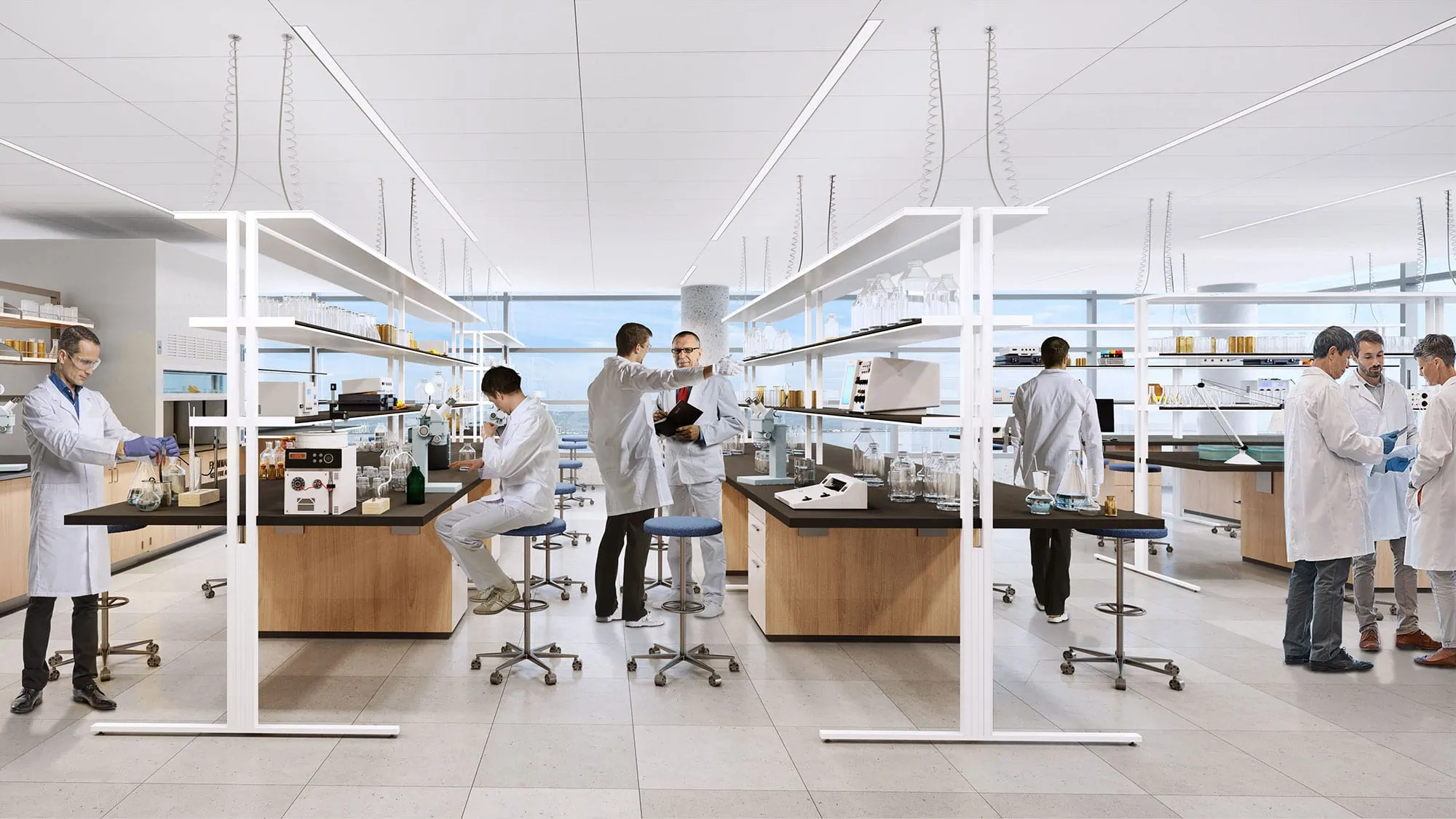 Scientists collaborate together in open concept lab space